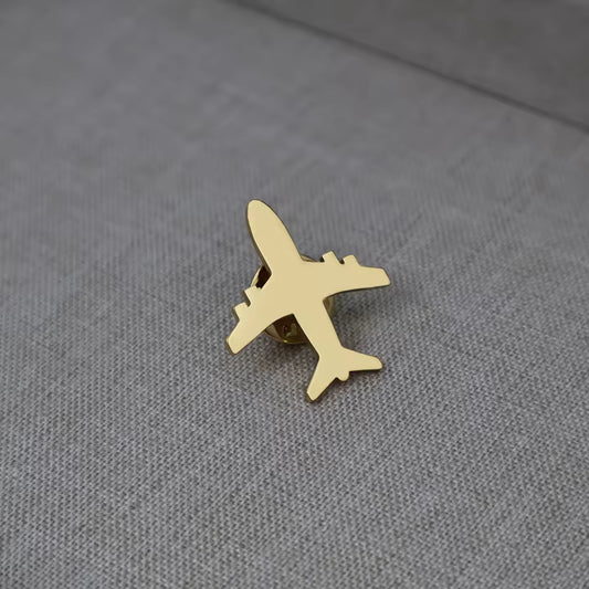 Broche avion doré