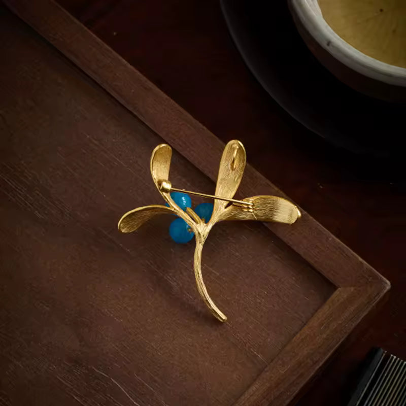 Broche baies de dos