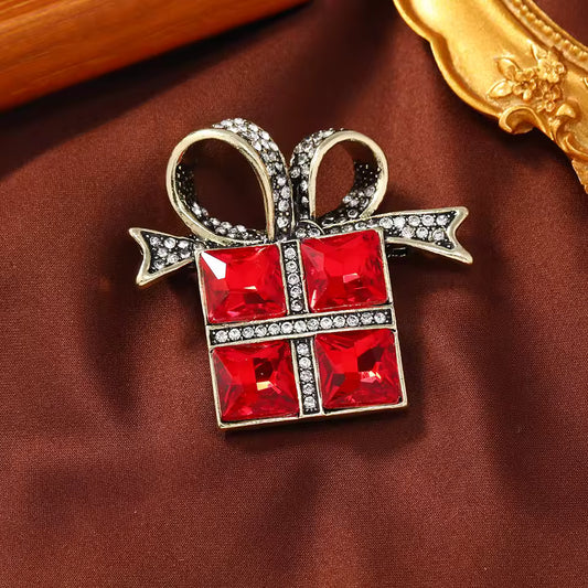 Broche cadeau rouge