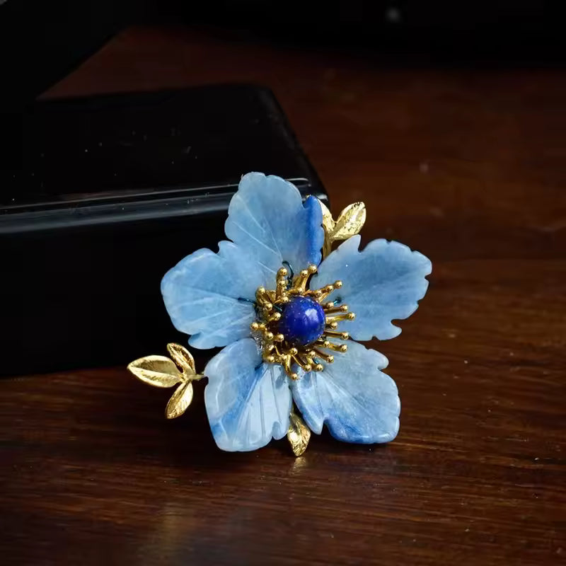 Broche fleur bleue dorée photo