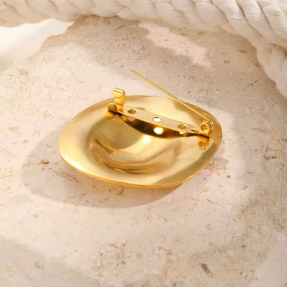 Broche galet de dos
