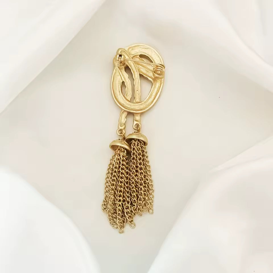 Broche lasso d’or de dos