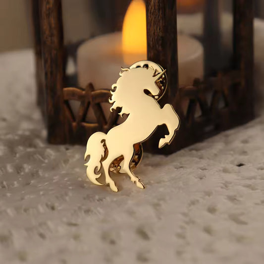 Broche licorne doré