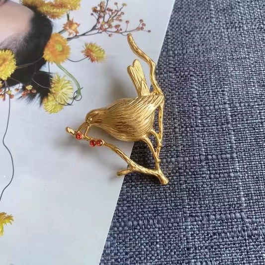 Broche oiseau aux baies