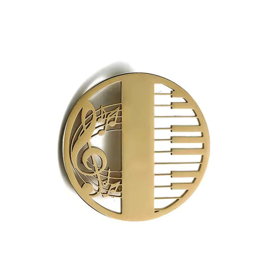 Broche piano musical