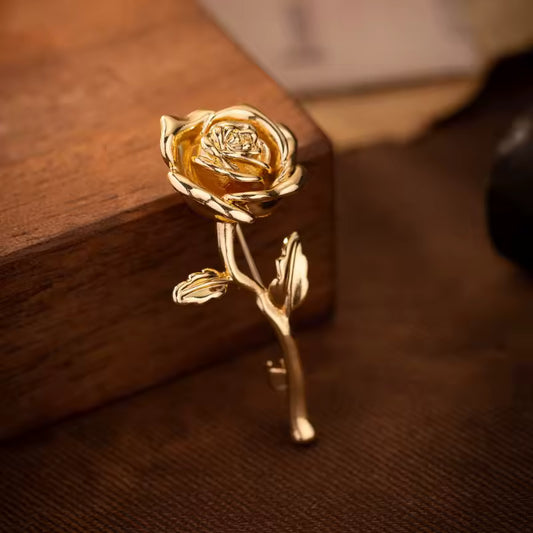 Broche rose dorée photo
