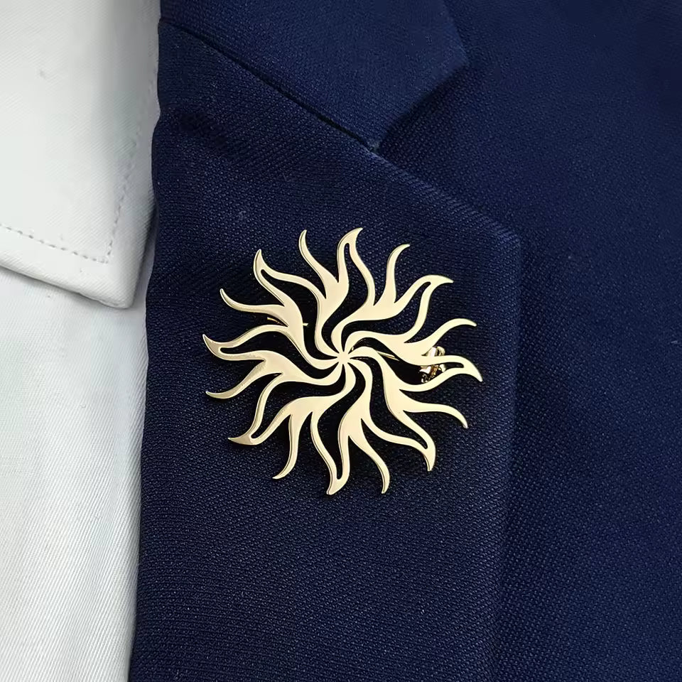 Broche soleil flamme porté