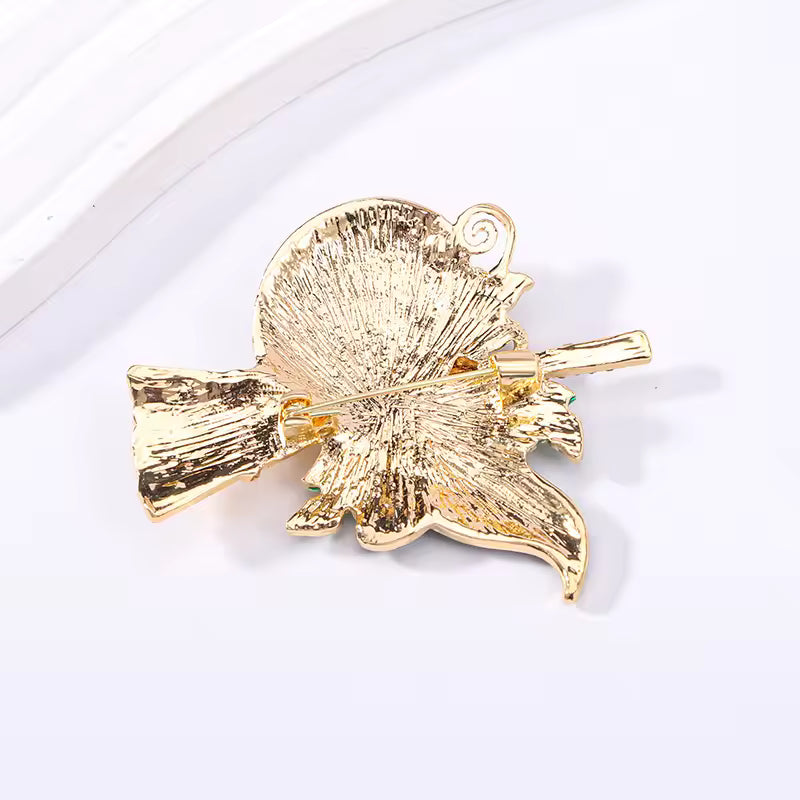 Broche sorcière citrouille de dos