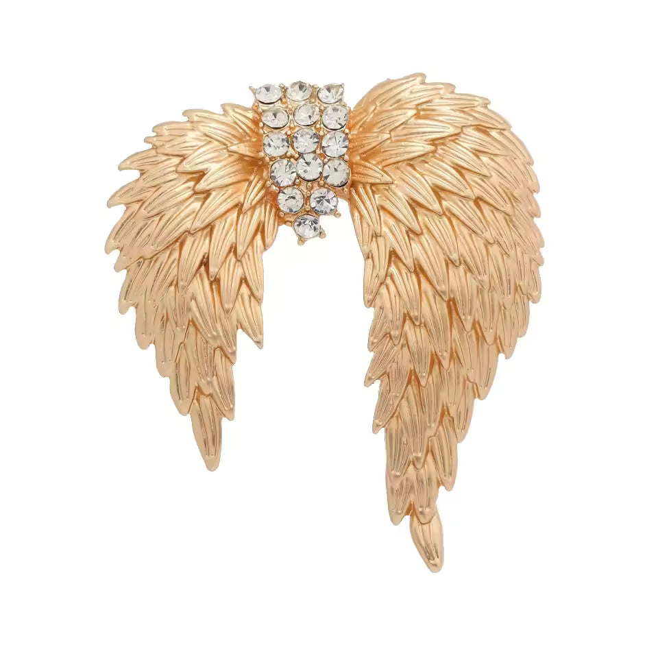 Broche ailes célestes, finition dorée, alliage métallique