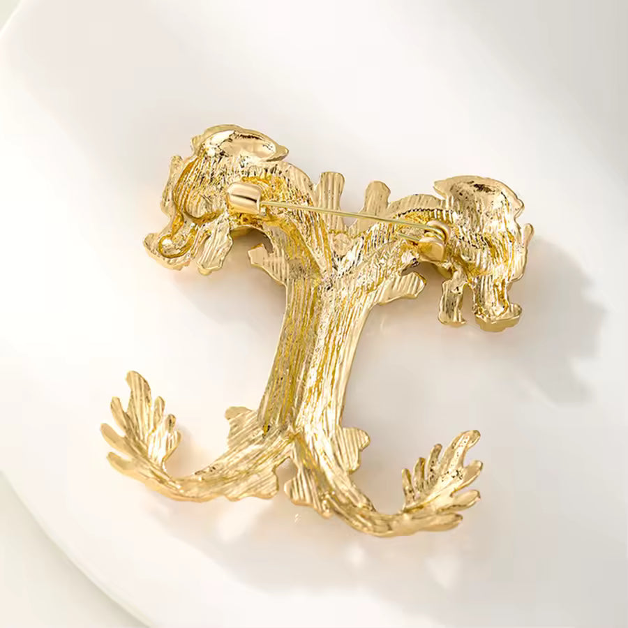 Broche dragons jumeaux vue de dos, fermoir épingle