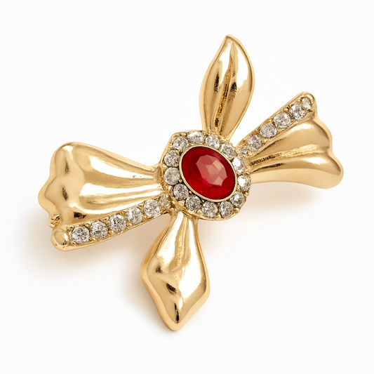 Broche nœud pierre rouge, finition dorée, alliage métallique